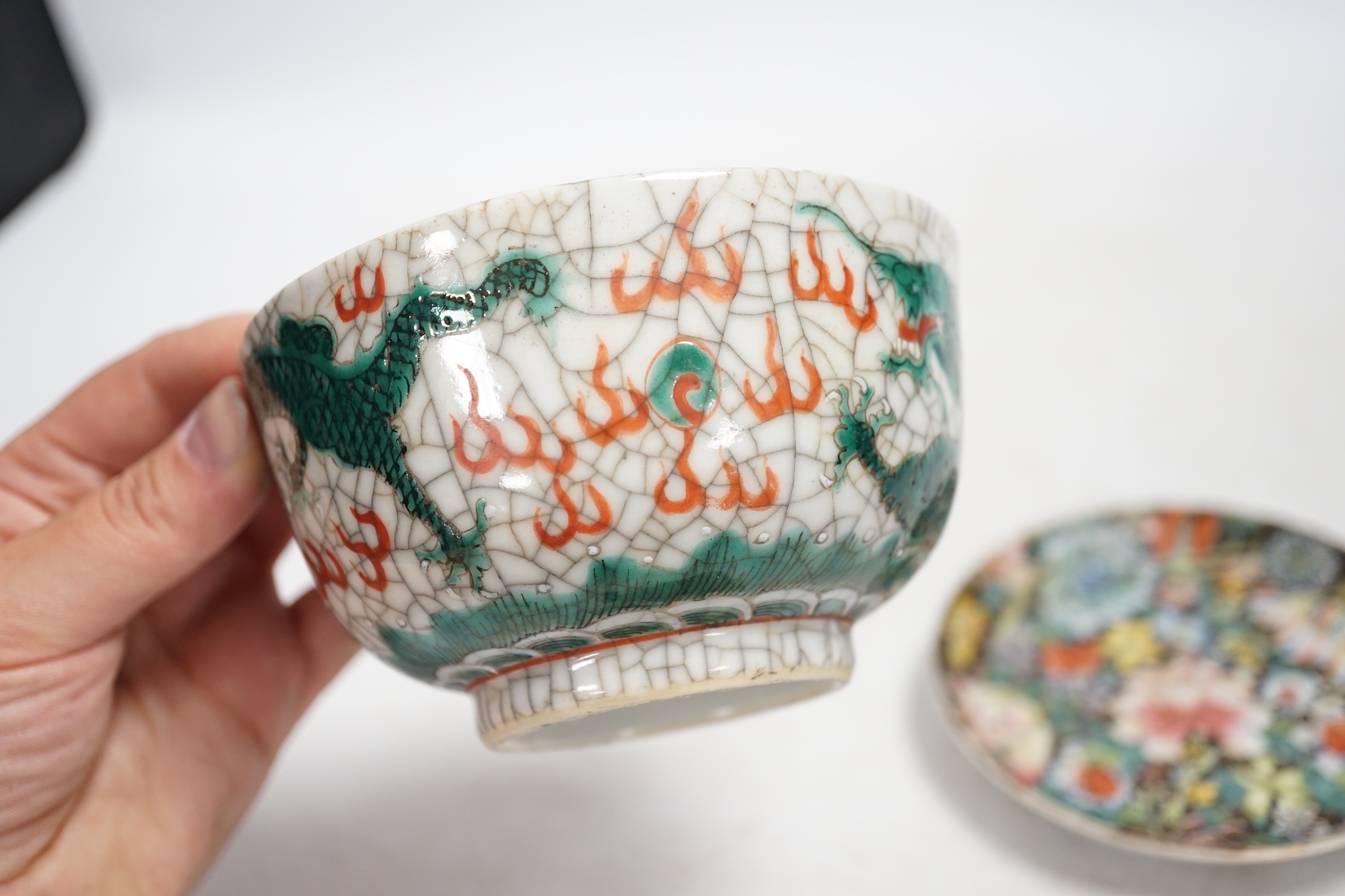 A Chinese crackleglaze famille verte ‘dragon’ bowl and a millefleur cup and saucer, bowl 11cm diameter. Condition - fair